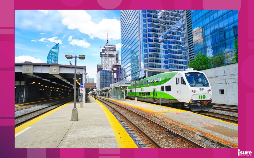 A GO Train sits at Union Station terminal on a sunny day.