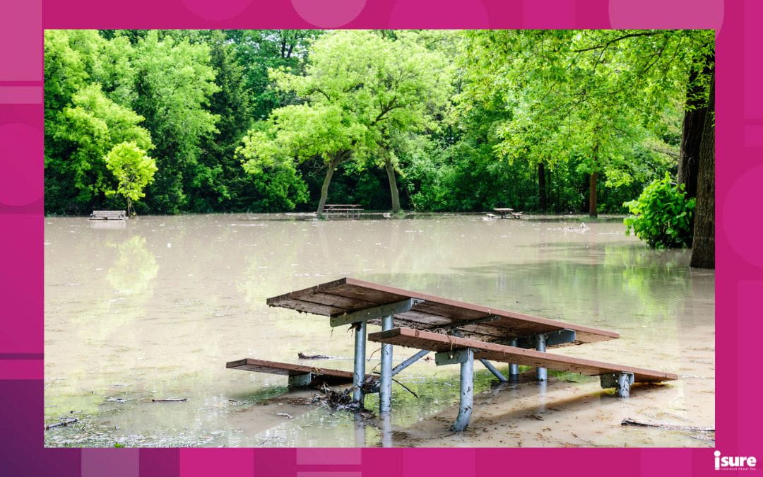 A flooded park bench in a Toronto Park. For major floods, mass evacuation coverage can help you remain housed.
