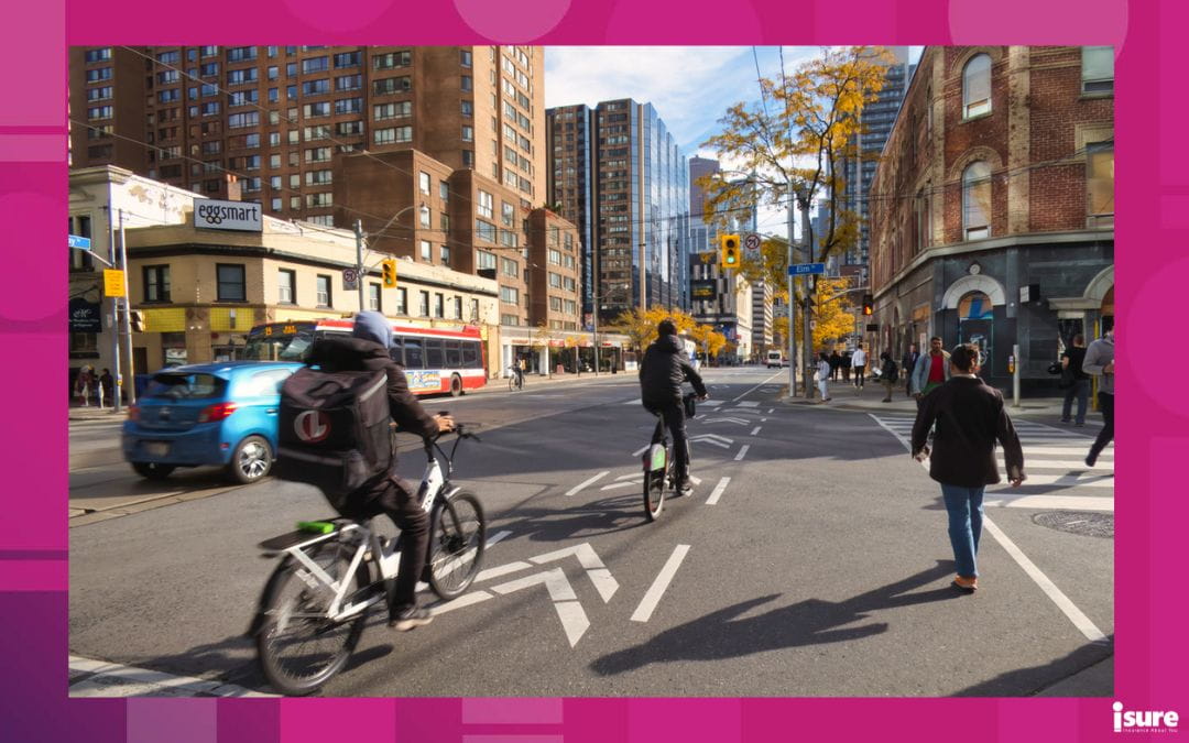 People following biking laws while biking the streets of downtown Toronto.