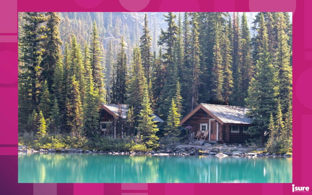 Two cottages sitting near a lake. For 2026, cottage prices are pointing towards us being in a buyers market.