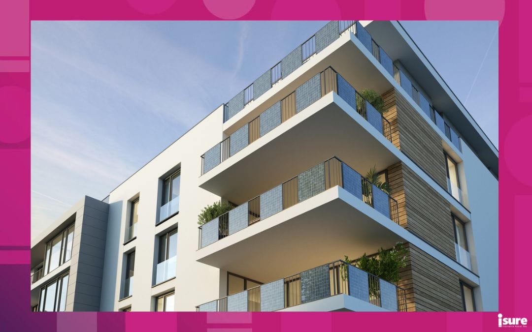 A condo building in a city with a blue sky behind it. In many cases, condos are considered secondary residences.