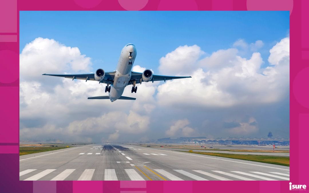 An airplane travels through the sky taking off, showing travelers with trip protection and travel insurance.
